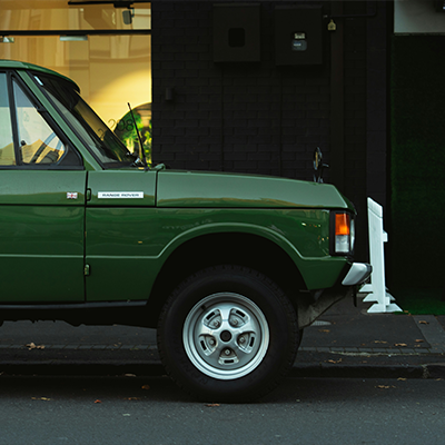 Classic Land Rover parked on a city street serviced by Bentley Auto Centre