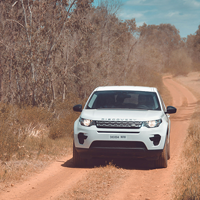 Land Rover Discovery navigating an offroad trail serviced by Bentley Auto Centre